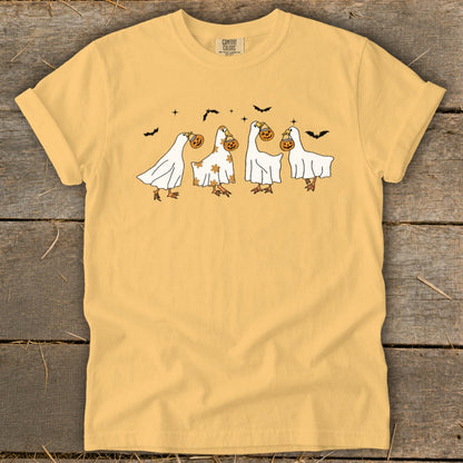 Four geese in ghost costumes holding jack-o'-lanterns, with bats above.