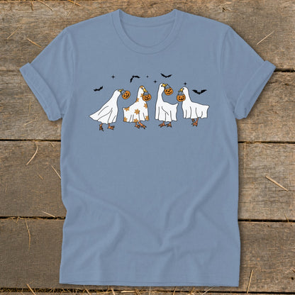 Four geese dressed as ghosts carry pumpkins while bats fly above.