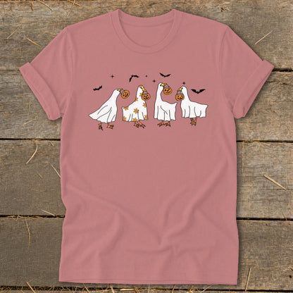 Four cartoon geese dressed as ghosts carry jack-o'-lanterns and bats fly above them.