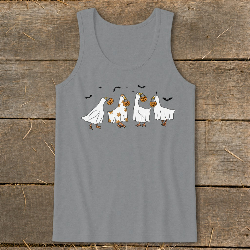Four geese dressed as ghosts carry pumpkins, with bats in the background.