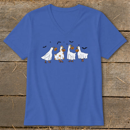 Four cartoon geese in ghost costumes hold pumpkins, with bats flying above.
