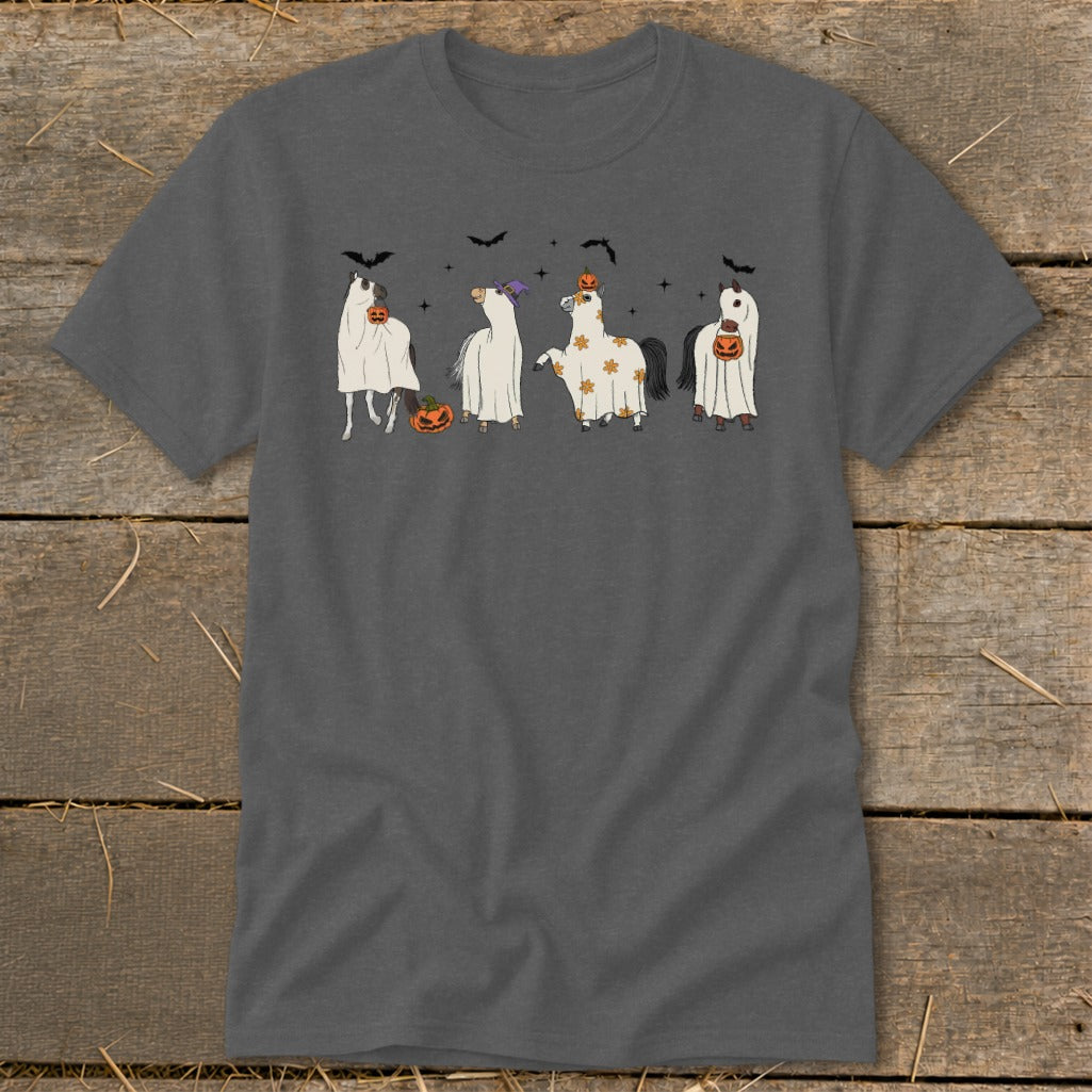 Four horses dressed as ghosts with pumpkins and bats for Halloween.