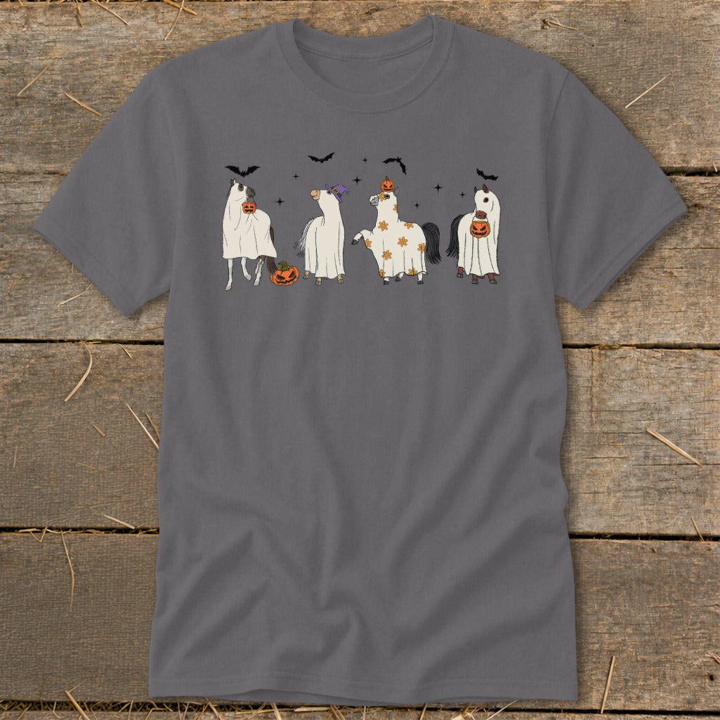 Four horses in ghost costumes hold pumpkins and wear Halloween accessories.