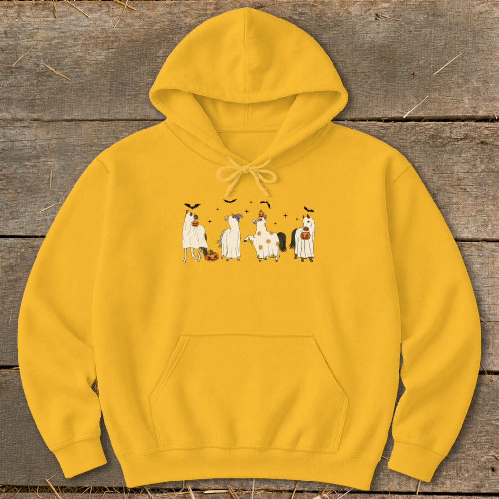 Yellow hoodie with four horses in ghost costumes and pumpkins.