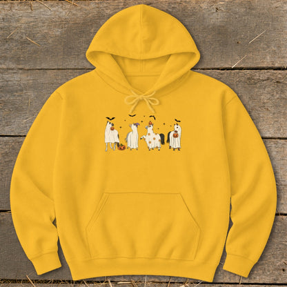 Yellow hoodie with four horses in ghost costumes and pumpkins.