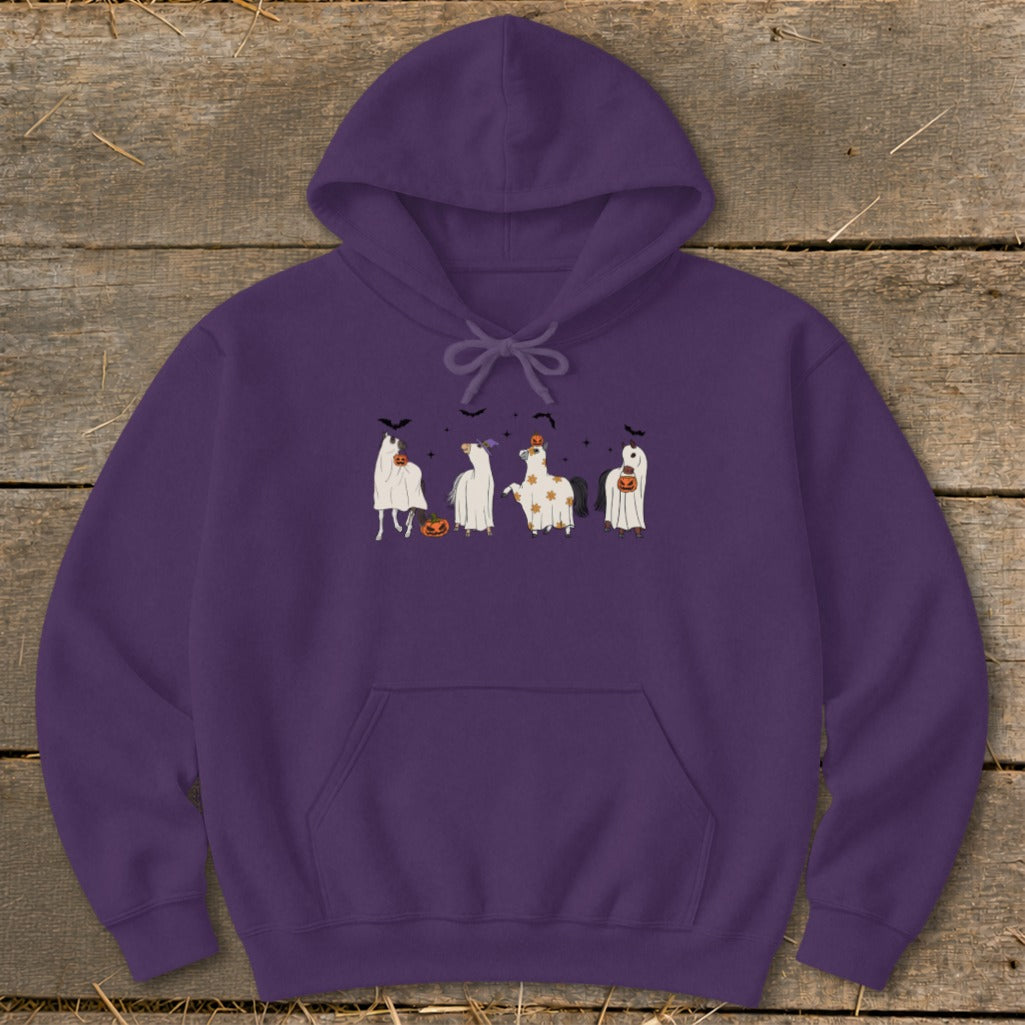 Purple hoodie with a Halloween print of horses dressed as ghosts with pumpkins.