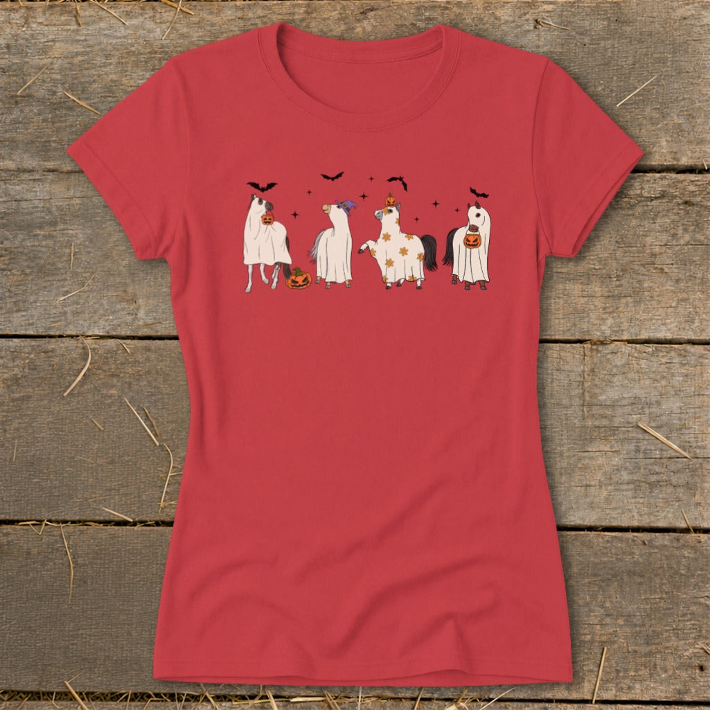 Four cartoon horses in Halloween ghost costumes with pumpkins and bats.