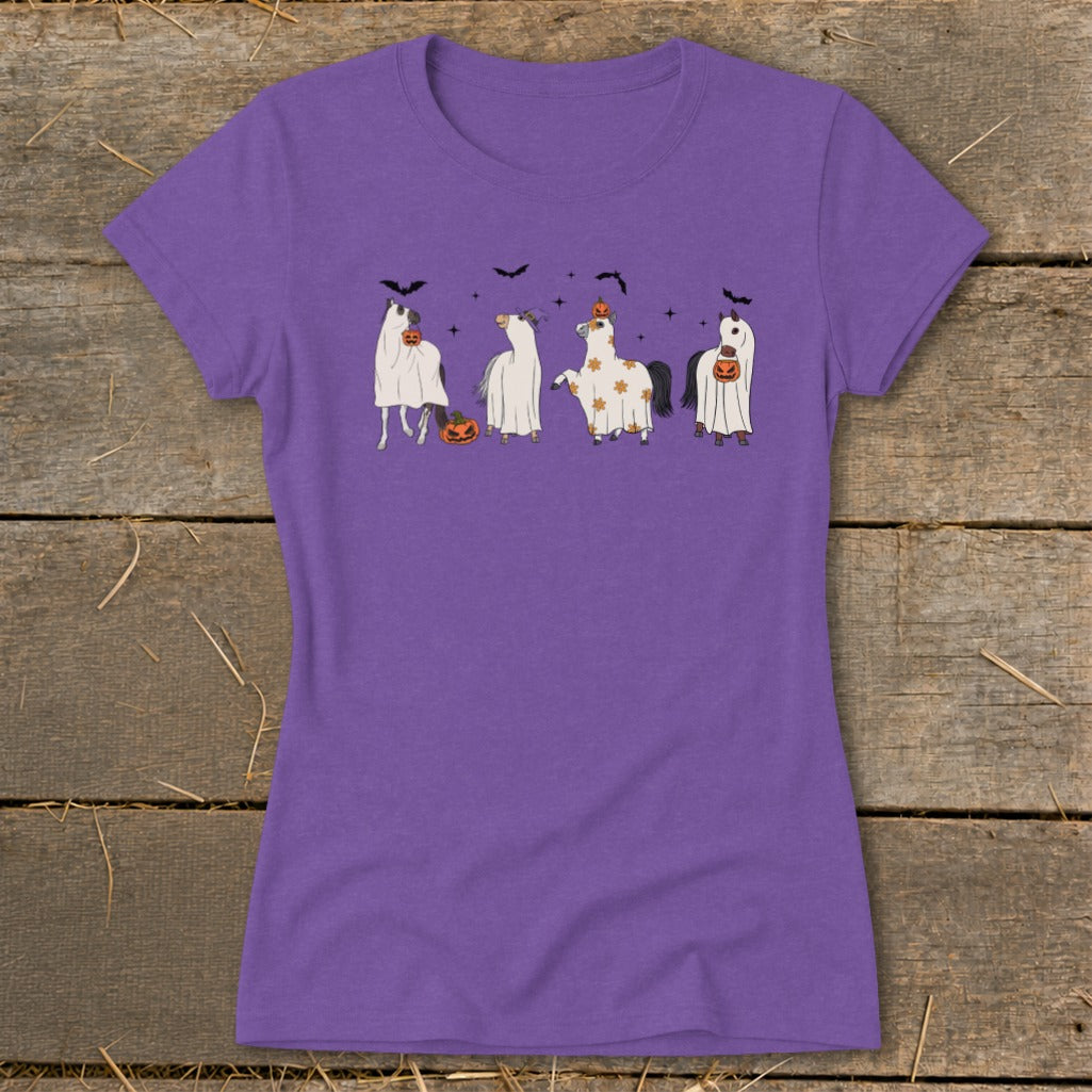 Purple t-shirt with cartoon horses dressed as ghosts for Halloween.