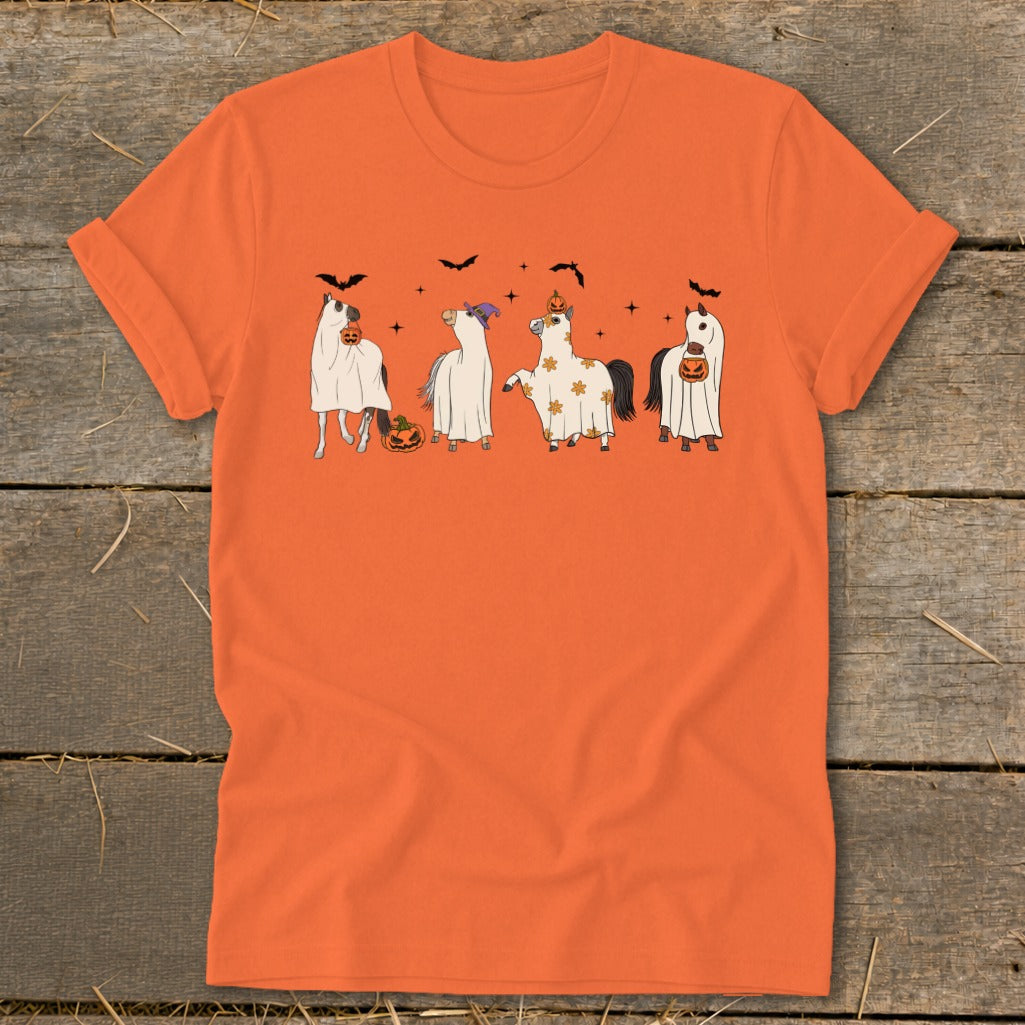 Four horses dressed as ghosts with pumpkins and bats for Halloween.