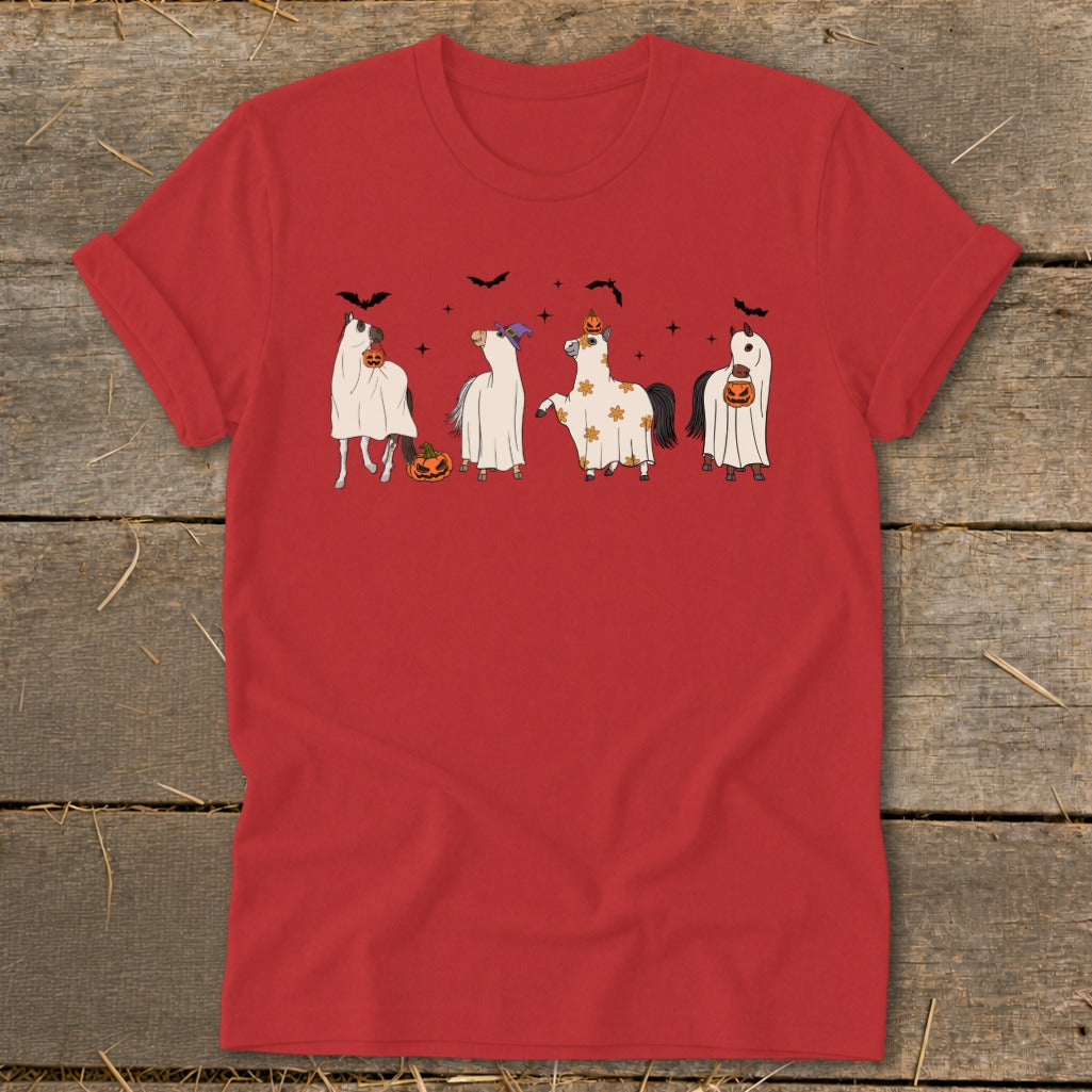 Four cartoon horses dressed as ghosts with pumpkins, bats, and stars on a red t-shirt.