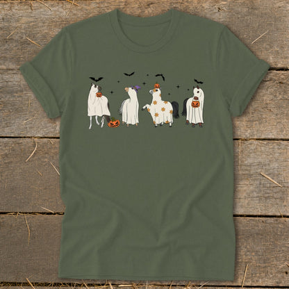 Four horses in ghost costumes with pumpkins and bats, on a green t-shirt.