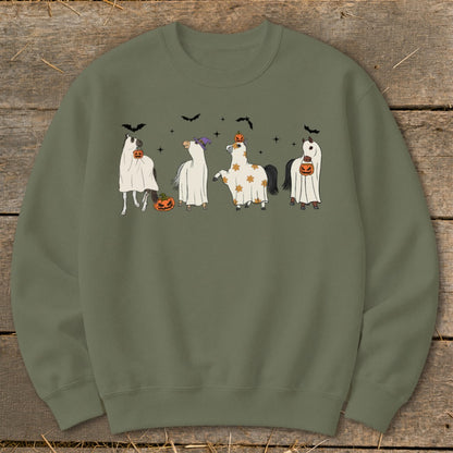 Four horses dressed as ghosts for Halloween with pumpkins and bats.