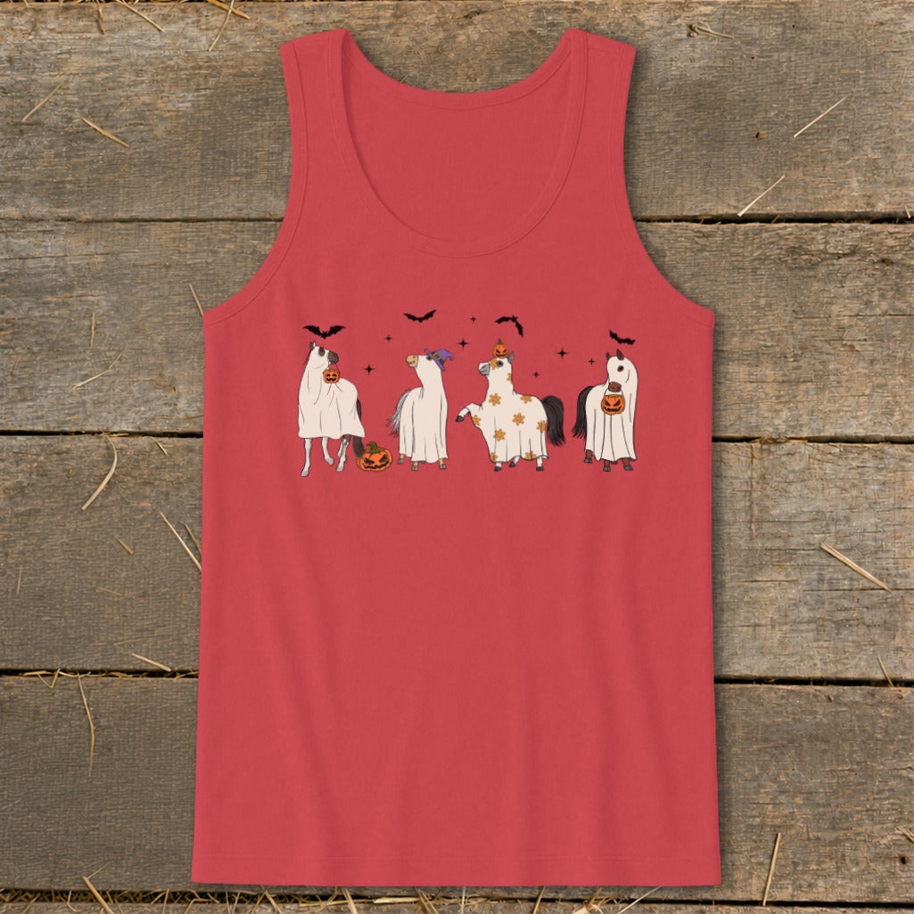 Four horses in Halloween costumes including ghosts and pumpkins.