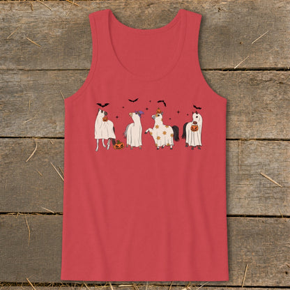 Four horses in Halloween costumes including ghosts and pumpkins.