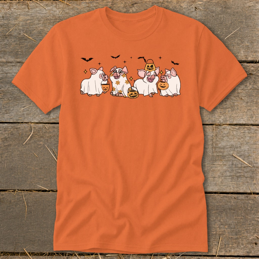 Five cartoon pigs in Halloween costumes holding pumpkins with bats above.