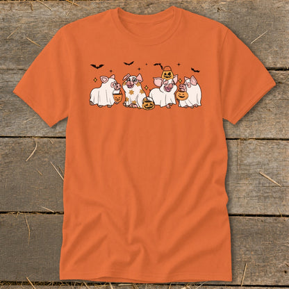 Five cartoon pigs in Halloween costumes holding pumpkins with bats above.