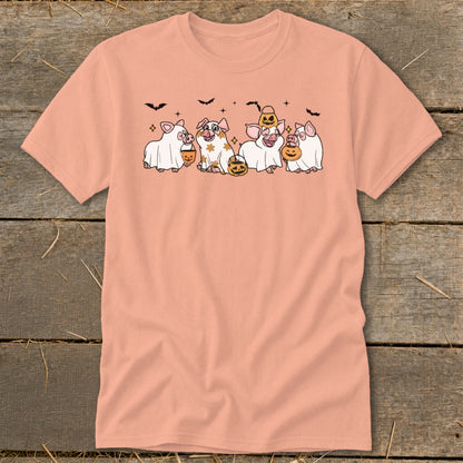 Five pigs dressed as ghosts hold pumpkins, with bats above.