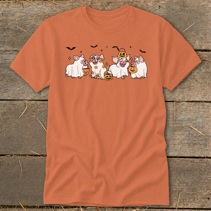 Orange t-shirt with five pigs dressed as ghosts holding pumpkins and bats above.