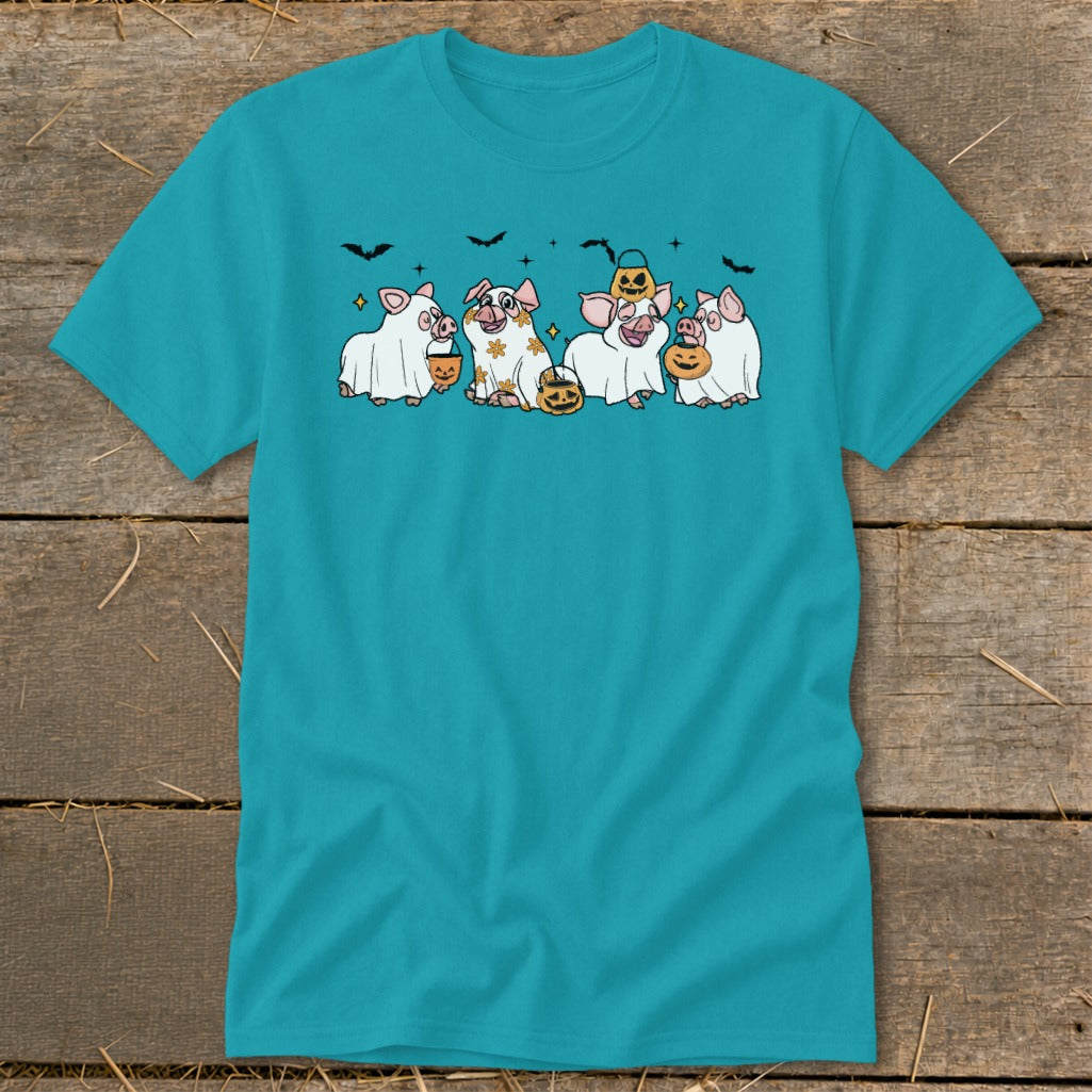 Four pigs dressed as ghosts with pumpkins and bats on a teal t-shirt.