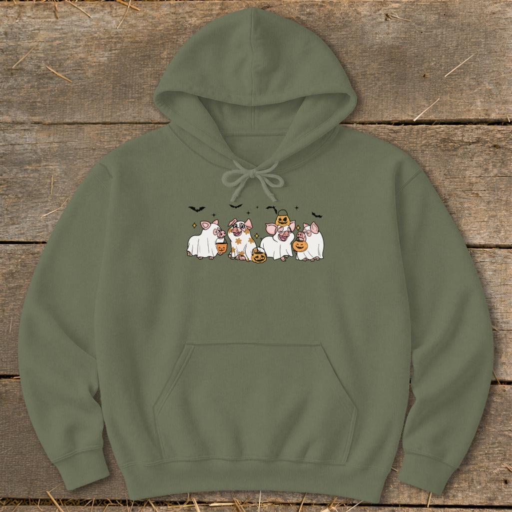 Green hoodie featuring Halloween pigs dressed as ghosts with pumpkins and bats.