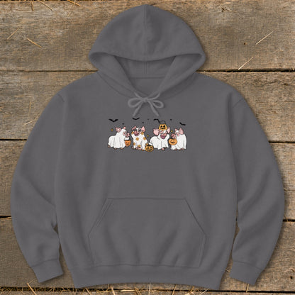 Four cartoon pigs in Halloween costumes holding candy buckets and pumpkins.