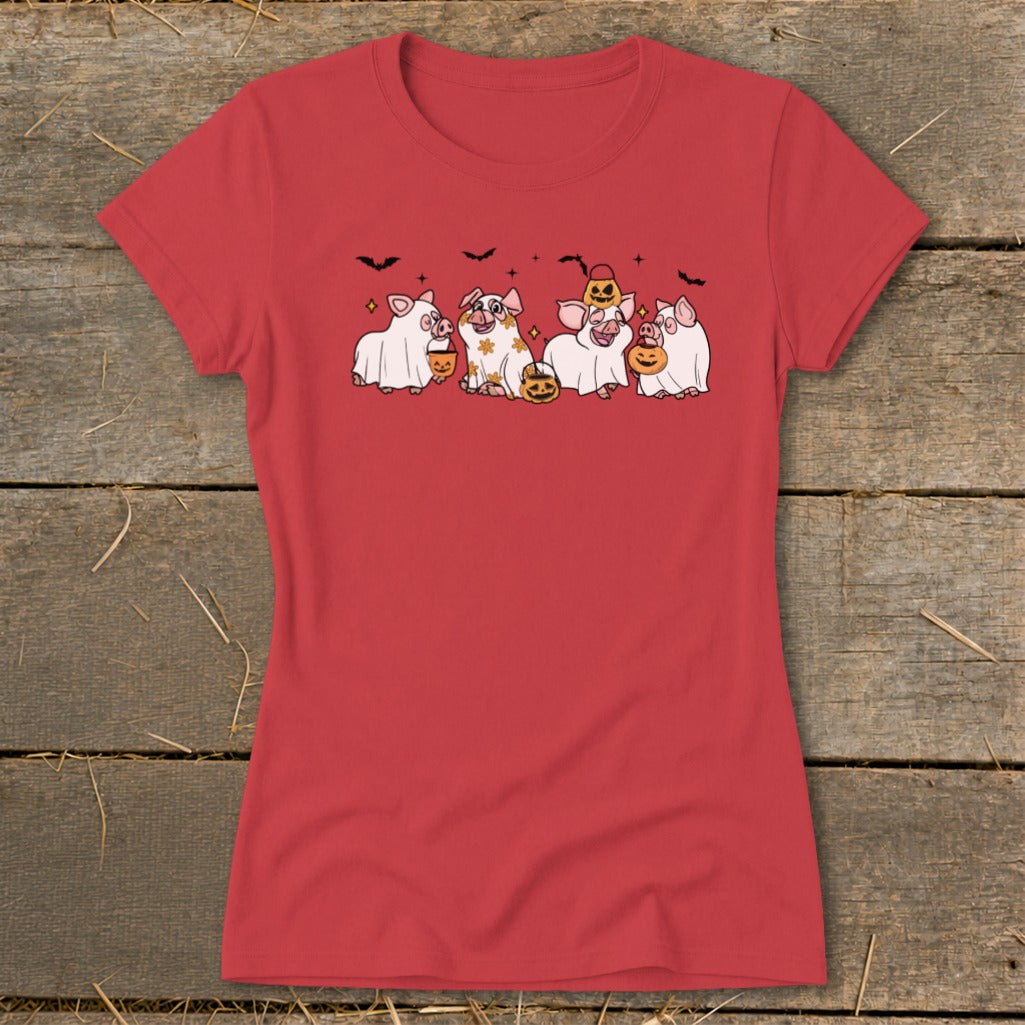 Red t-shirt with cartoon pigs dressed as ghosts for Halloween holding pumpkin buckets.