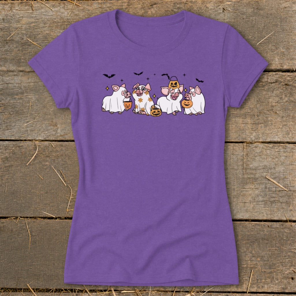 Five cartoon pigs in Halloween costumes with pumpkins and bats.