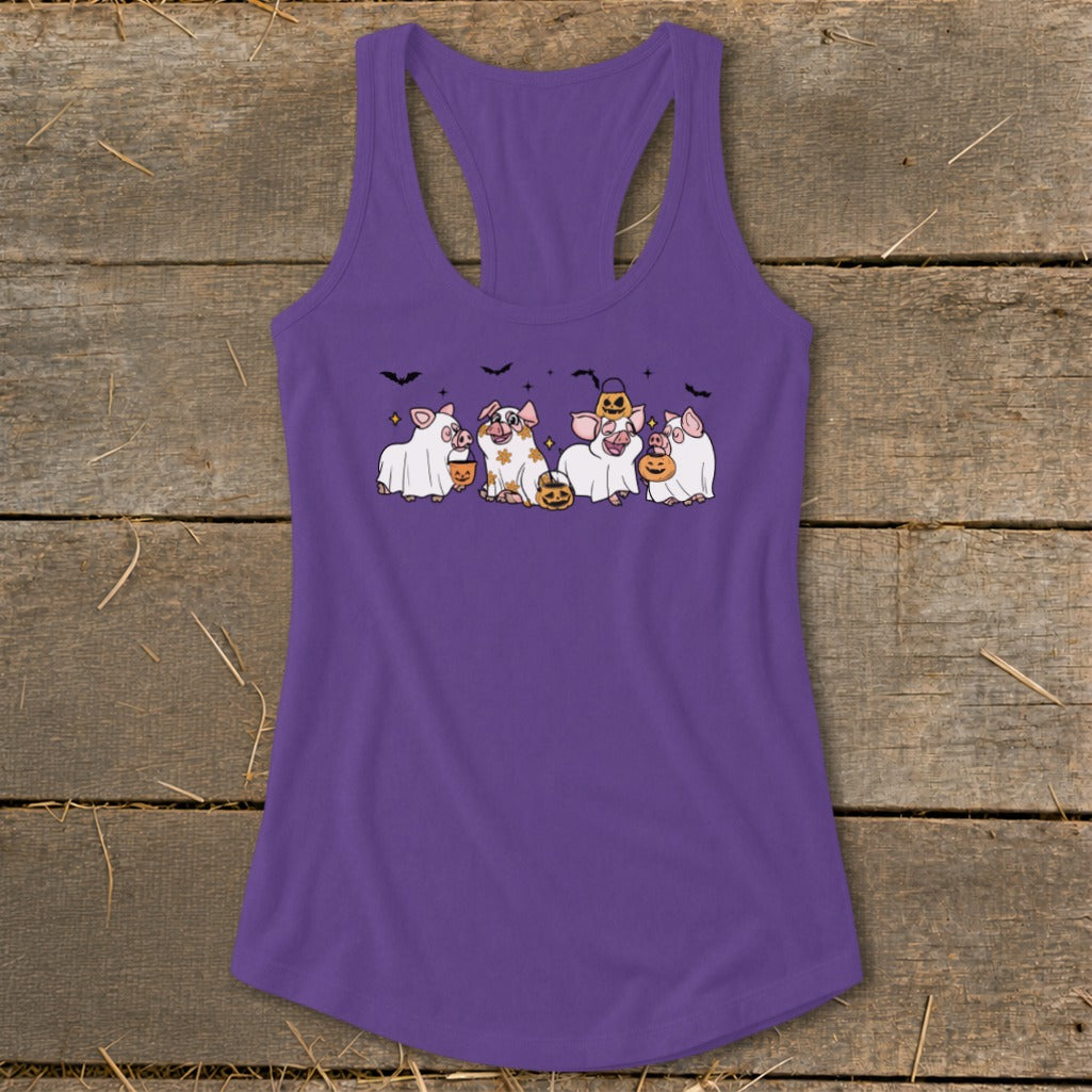 Purple tank top with cartoon pigs dressed in Halloween costumes.