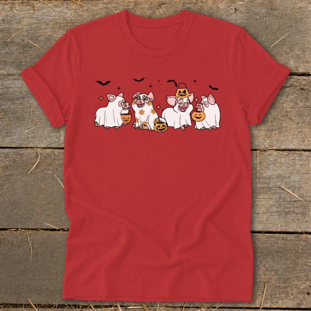 Red t-shirt with cartoon pigs dressed as ghosts carrying pumpkins.