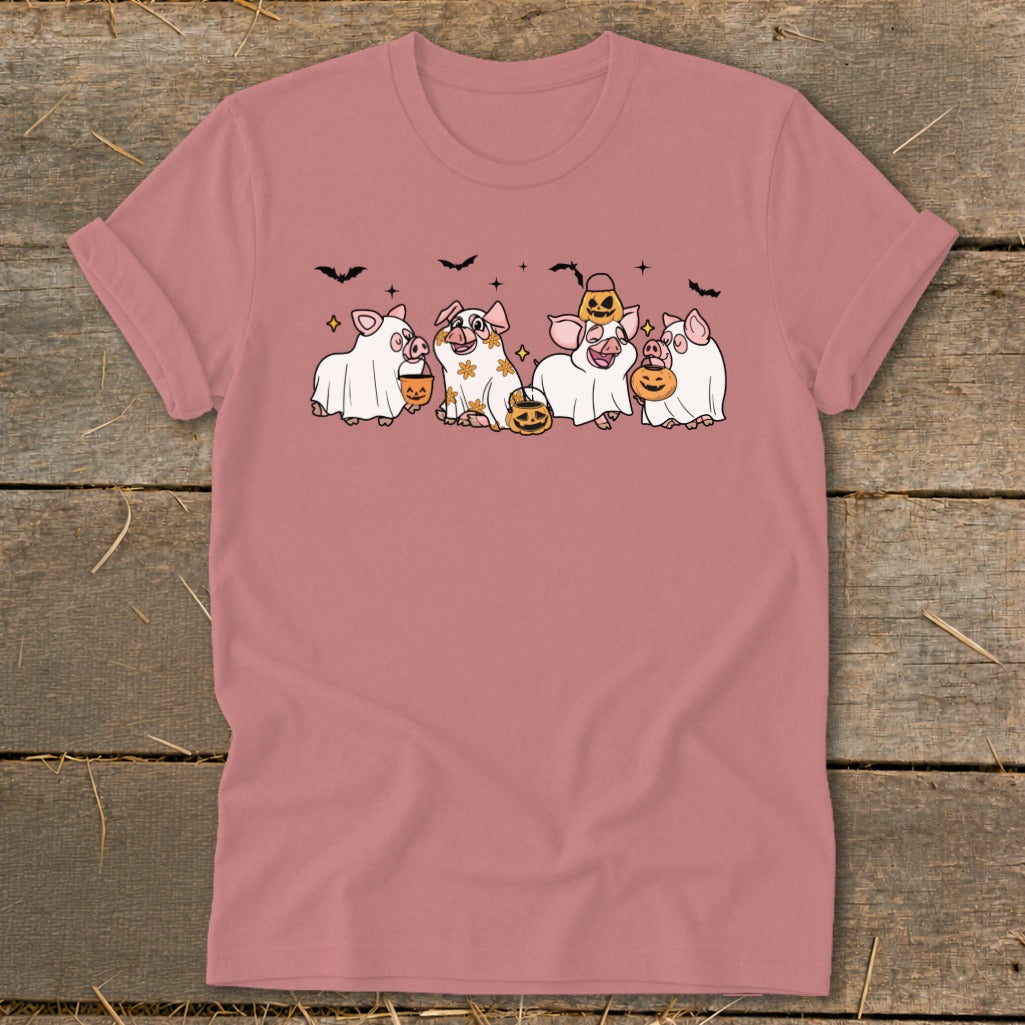 Five pigs dressed as ghosts, holding pumpkins and wearing Halloween hats.