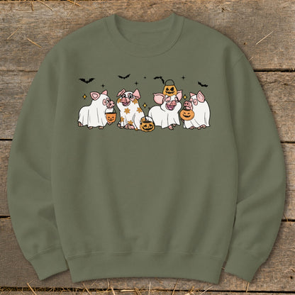 Five cute pigs dressed as ghosts holding pumpkins, with bats overhead.