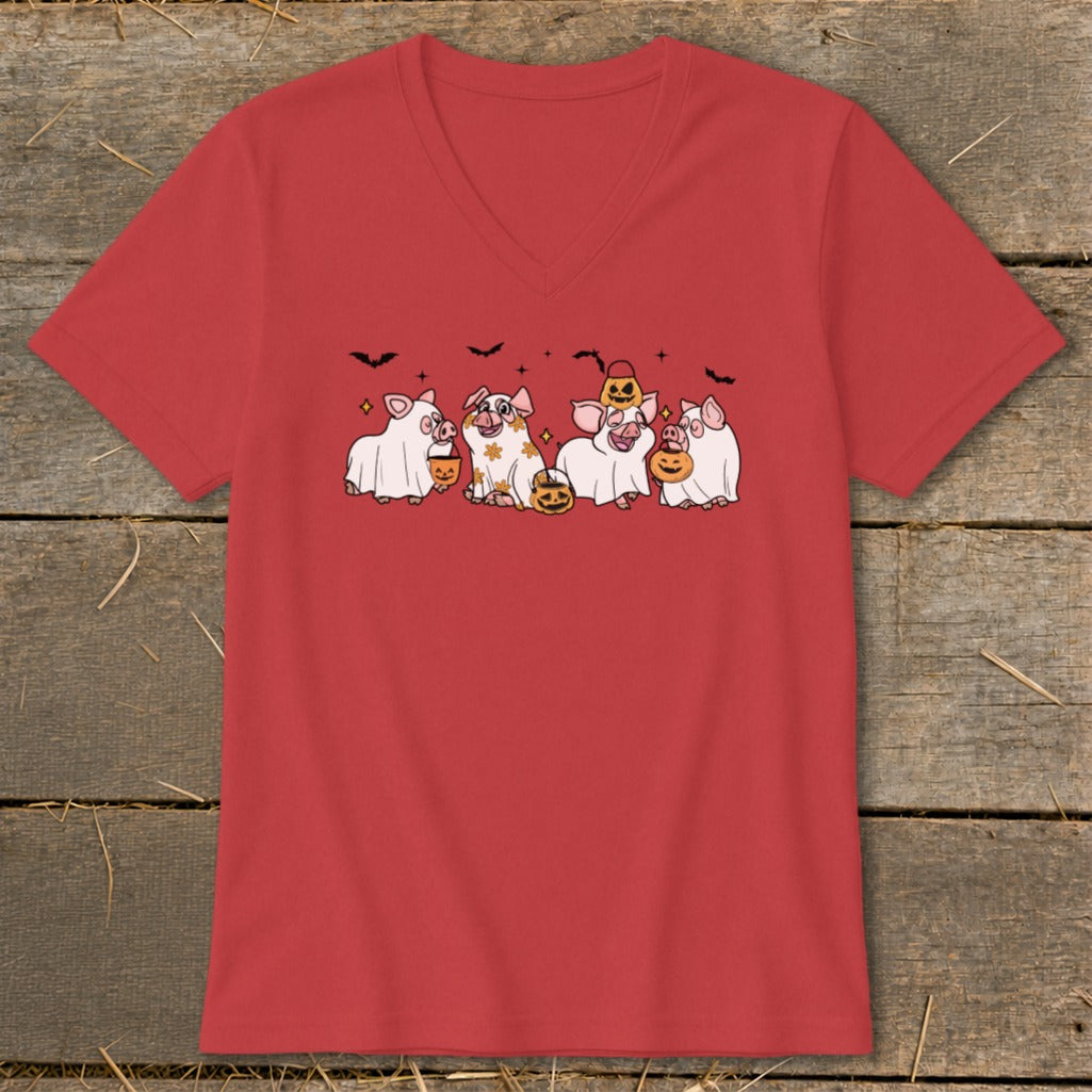 Five cartoon pigs in Halloween costumes holding pumpkins and candy buckets.