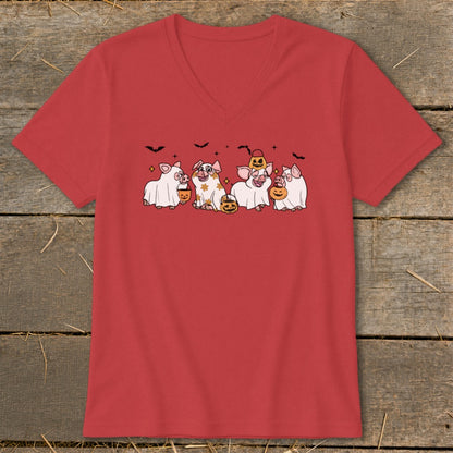Five cartoon pigs in Halloween costumes holding pumpkins and candy buckets.