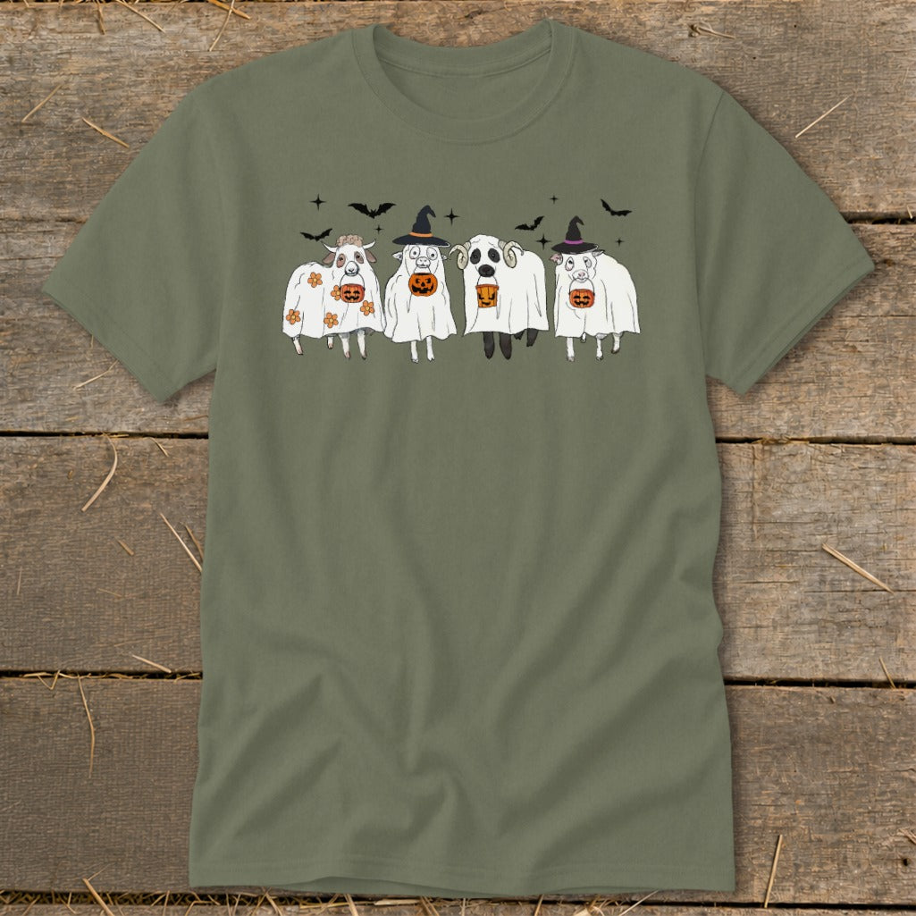 Four sheep dressed as ghosts with pumpkins and witch hats, with bats in the background.