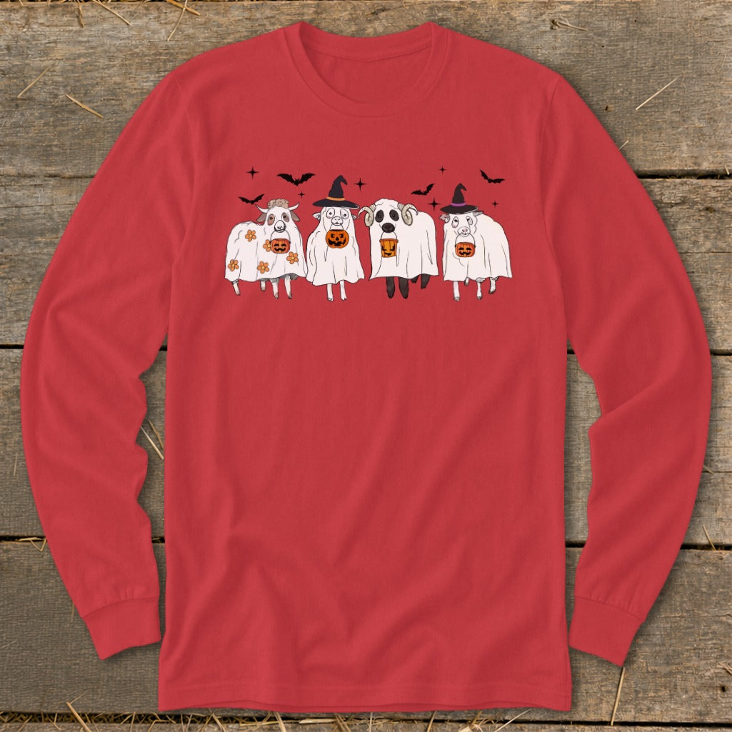 Four sheep dressed as ghosts hold pumpkins, wearing witch hats on a red shirt.