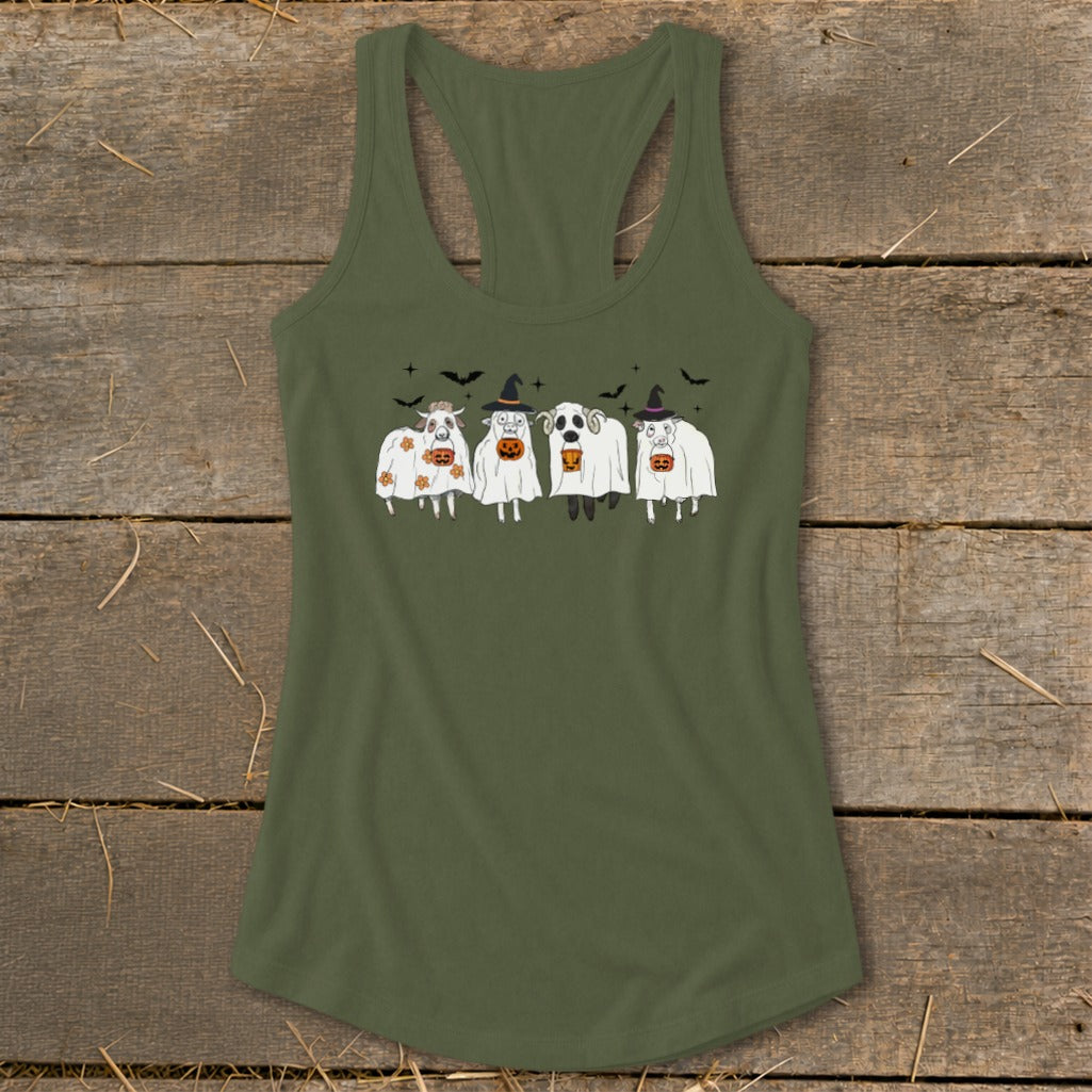 Four sheep dressed as ghosts and pumpkins, wearing witch hats.