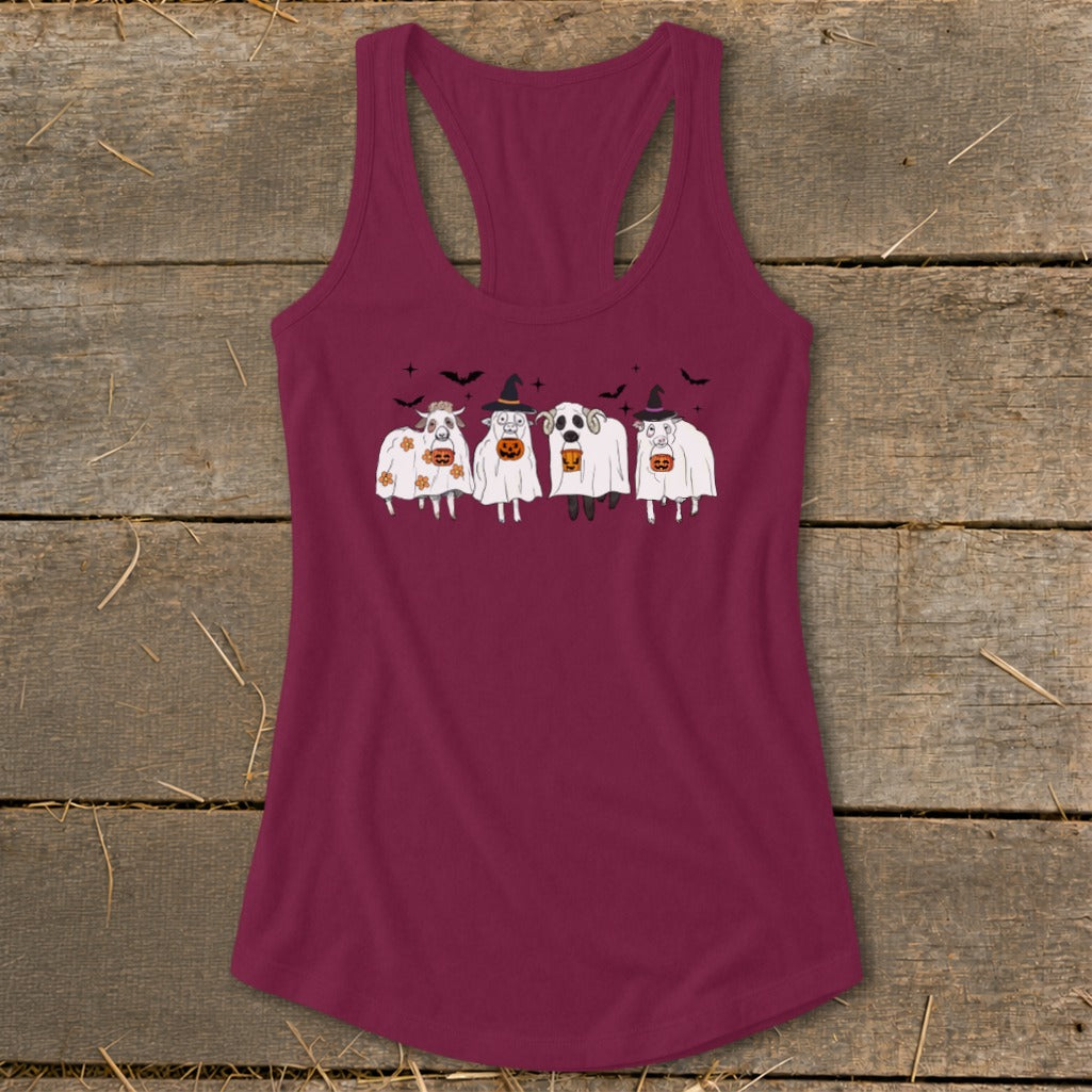 Four cartoon sheep dressed as ghosts hold pumpkins with bats flying above.