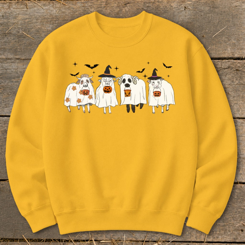 Yellow sweatshirt with four cartoon sheep dressed as ghosts holding pumpkins.
