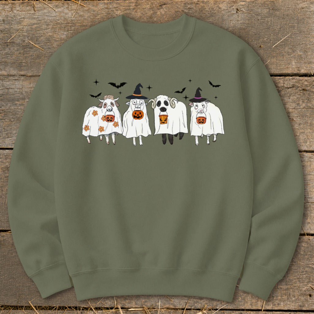 Four sheep in ghost costumes with pumpkins, bats, and witch hats.