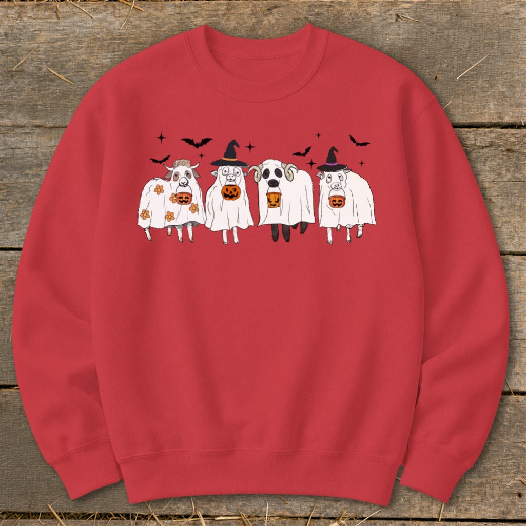 Four sheep dressed as ghosts hold jack-o'-lanterns against a red background.