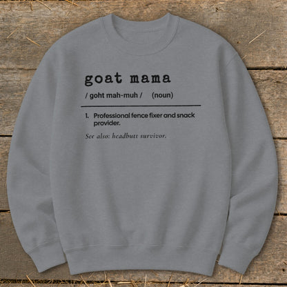 A grey crewneck sweatshirt printed with a dictionary definition graphic that reads goat mama.