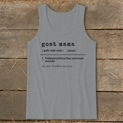 A grey tank top printed with a dictionary definition of goat mama on a wooden background.