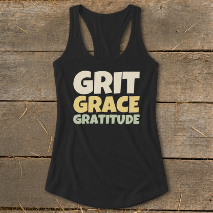 Black racerback tank top with the words GRIT GRACE GRATITUDE printed on the front in cream, yellow, and green.