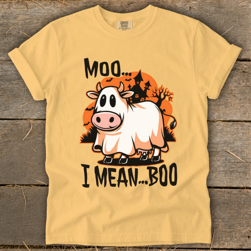 A yellow t-shirt features a cartoon cow in a ghost costume with the text Moo, I mean... Boo.