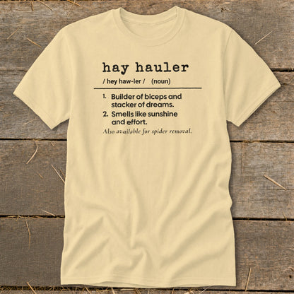 Yellow t-shirt with "hay hauler" definition: builder of biceps, smells like sunshine.