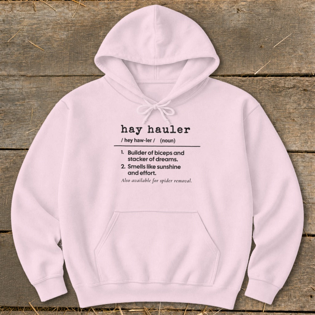 Pink hoodie with definition of "hay hauler" printed on it.