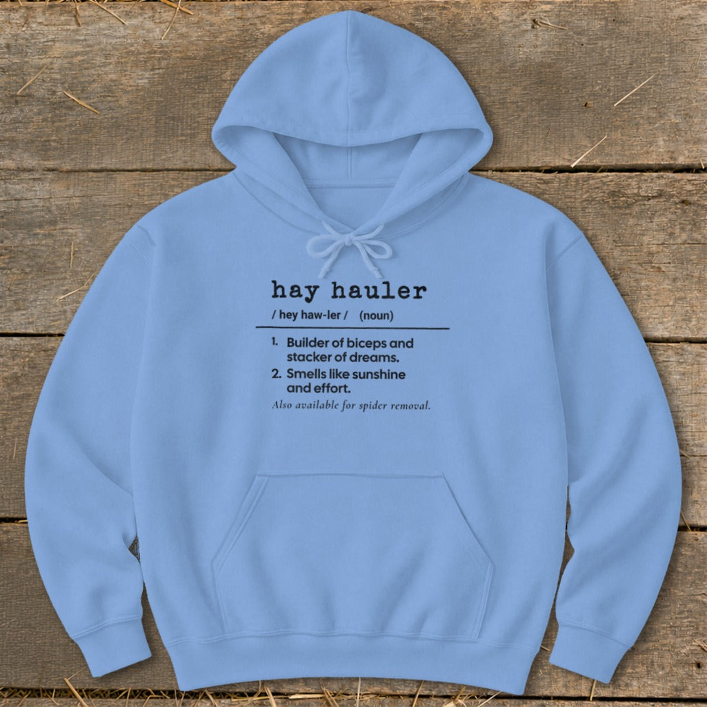 Light blue hoodie with "hay hauler" definition: builder of biceps, smells like sunshine.
