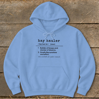Light blue hoodie with "hay hauler" definition: builder of biceps, smells like sunshine.
