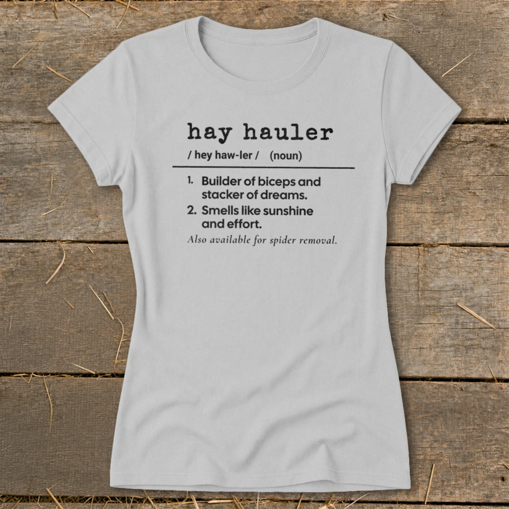 Light grey t-shirt with "hay hauler" definition: builder of biceps, smells like sunshine, spider removal.