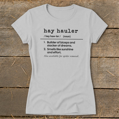 Light grey t-shirt with "hay hauler" definition: builder of biceps, smells like sunshine, spider removal.
